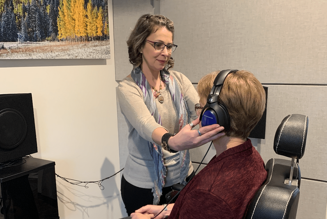 Erika Shakespeare of Audiology & Hearing Aid Associates performing hearing test