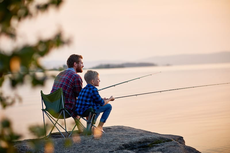 Father and Son Enjoying Fishing Together